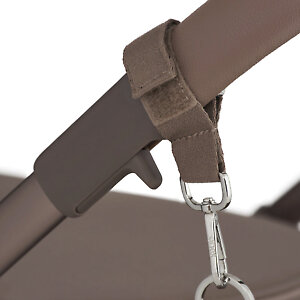 Крепится на ручку любой коляски с помощью карабинов с липучками